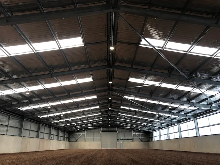 Indoor riding arena at Cavallino Estate lit with LED highbay fittings installed by KRC