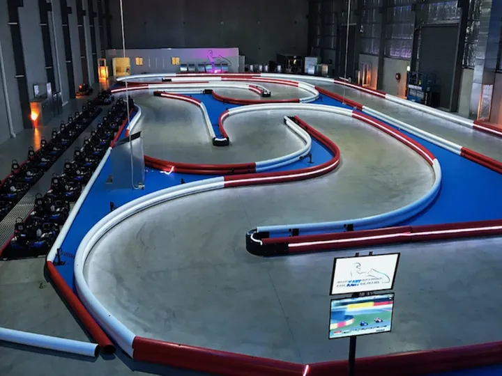 The Kart Centre's indoor track with LED rope lighting along the bumpers, installed by KRC